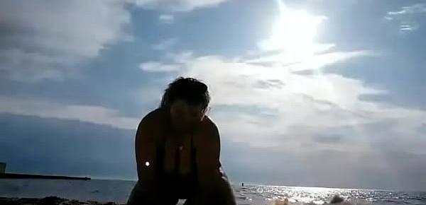  Sexy and hot mommy playing on public beach naked